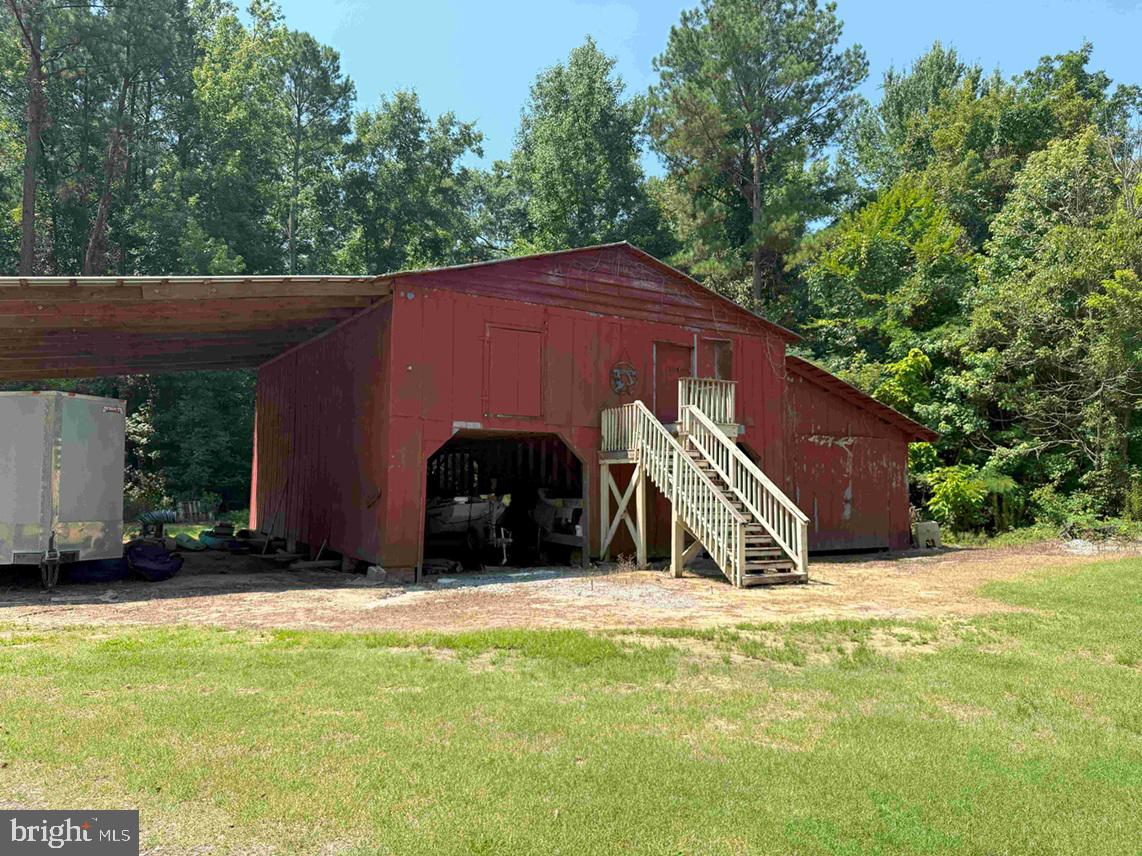 Tick Bite Road Grifton, NC 28530 - Photo 28 of 57 a view of a house with a yard and a small barn