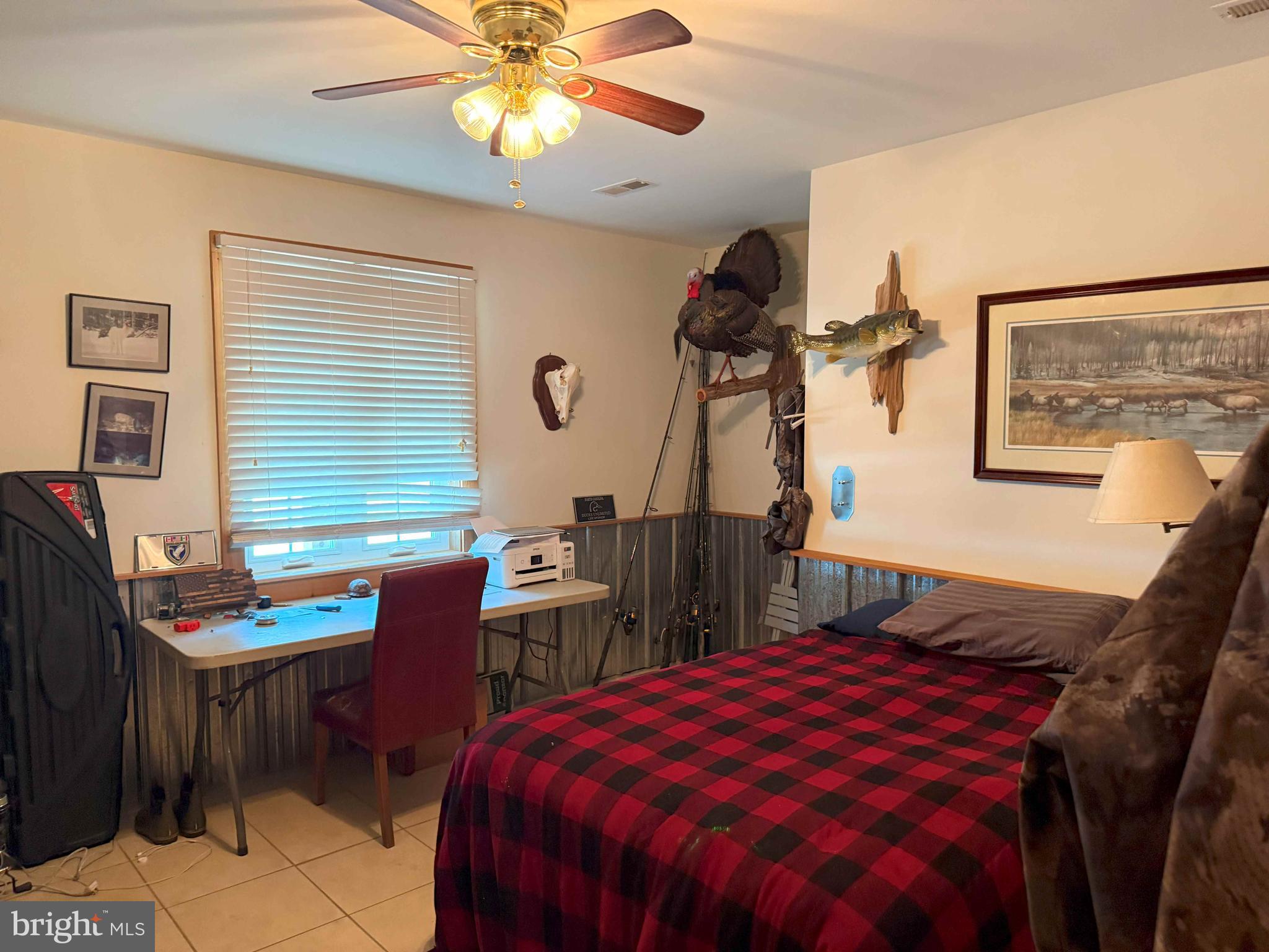 Tick Bite Road Grifton, NC 28530 - Photo 38 of 57 a bed room with a bed and a chandelier