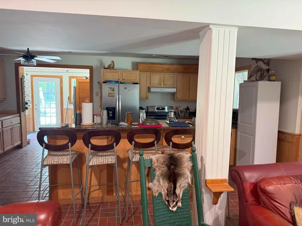 a view of room with stairs and a rug