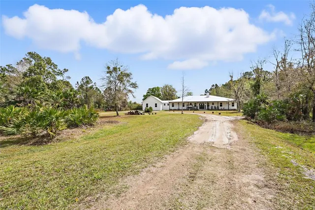 a view of a swimming pool with a yard