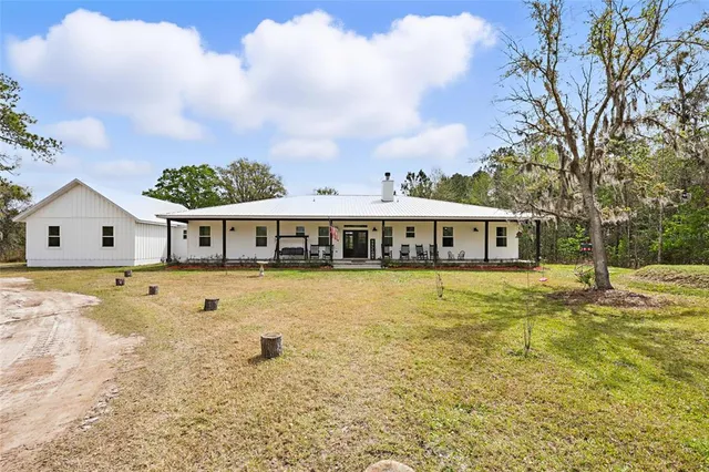 a view of a yard with an outdoor space