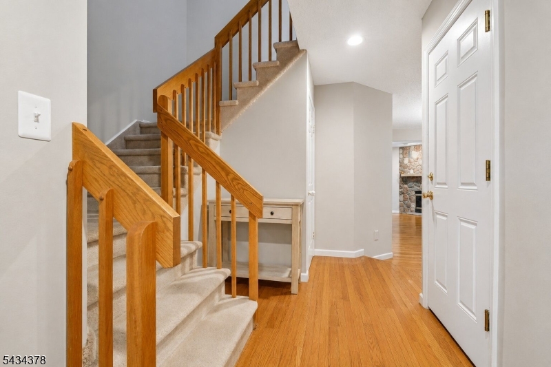 606 Park Place Springfield, NJ 07081 - Photo 3 of 21 a view of entryway with wooden floor and stairs