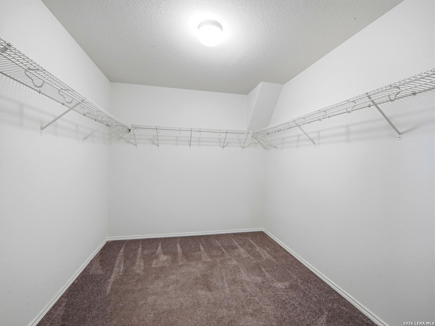 308 Autumn Rouge New Braunfels, TX 78130 - Photo 13 of 15 a view of a room with racks on the wall