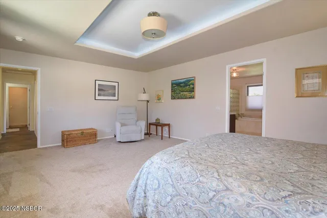 a bathroom with a tub a sink shower and a mirror
