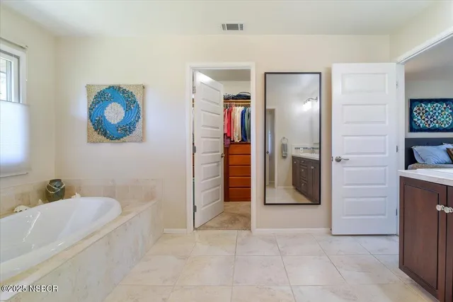 a bedroom with a bed and a table