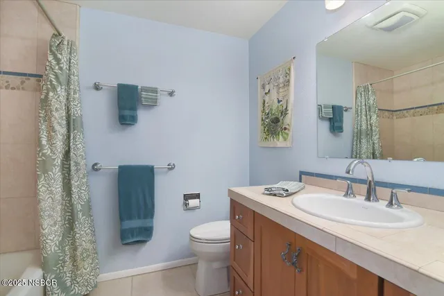 a bedroom with a bed and a lamp