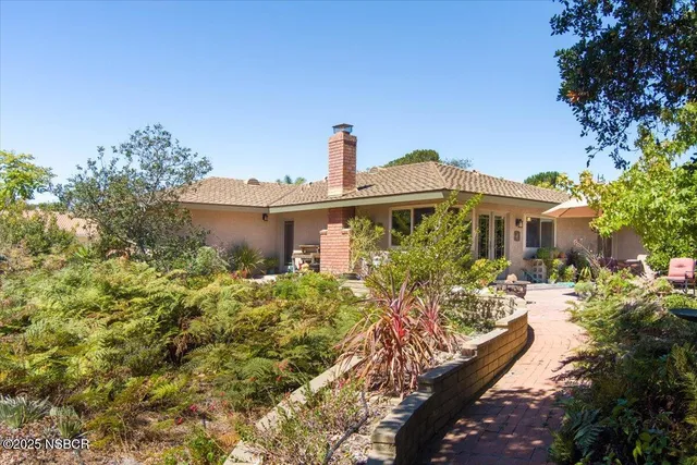 a house with a tree in front of it