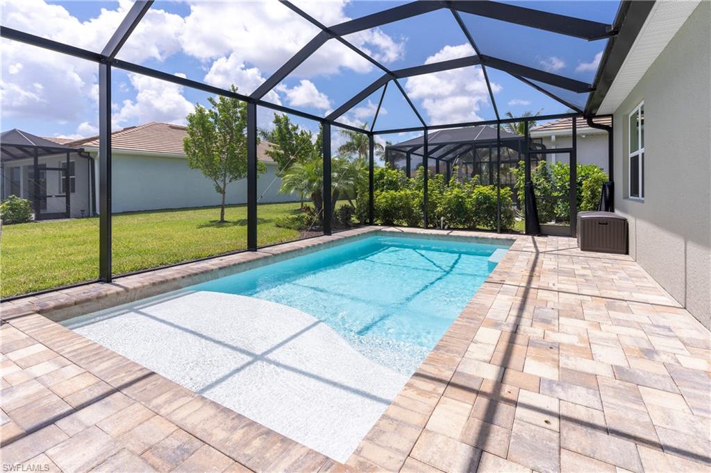 14488 Stillwater Way Naples, FL 34114 - Photo 14 of 37 a view of a patio with a yard