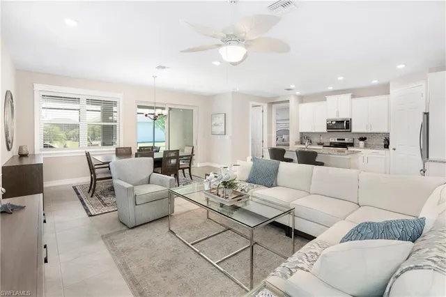 a living room with furniture white walls and white walls