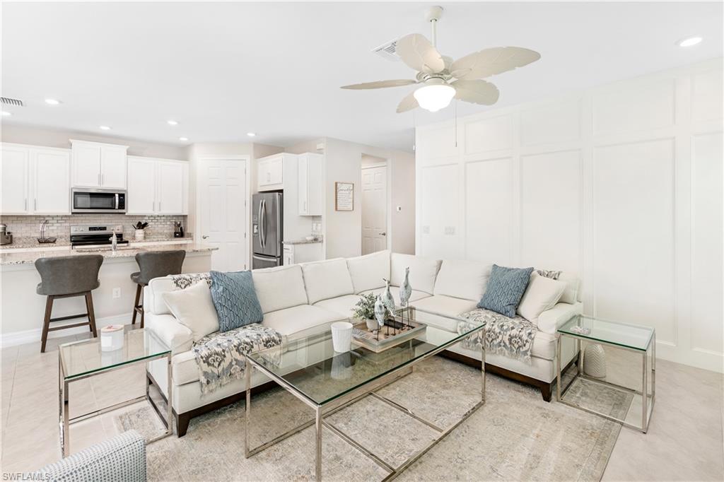 14488 Stillwater Way Naples, FL 34114 - Photo 5 of 37 a living room with furniture and a view of kitchen