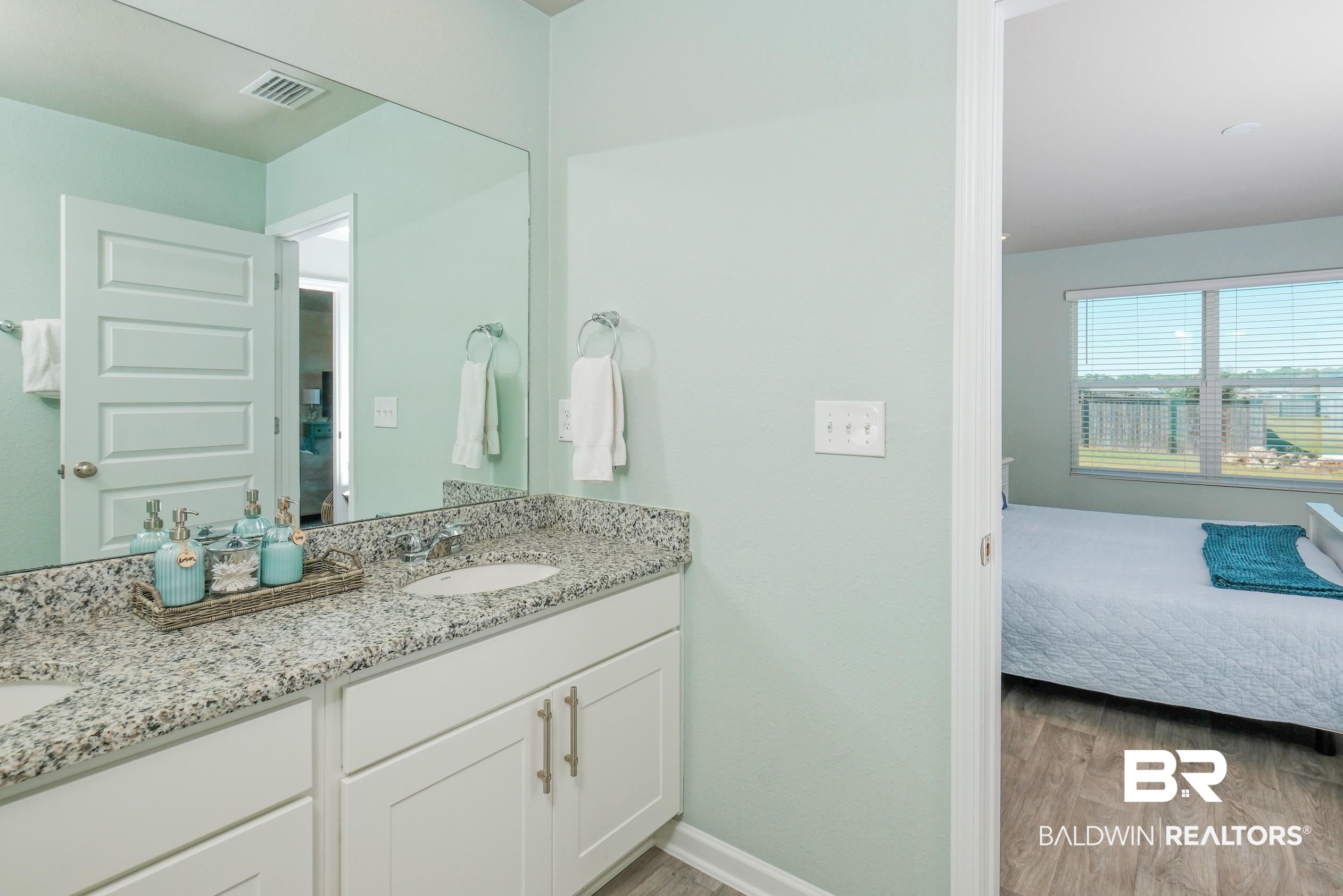 7425 Coppin Drive Foley, AL 36535 - Photo 22 of 41 Bathroom featuring vanity and hardwood / wood-style flooring