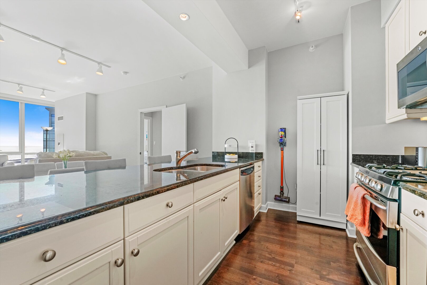 1201 South Prairie Avenue, Unit 3404 Chicago, IL 60605 - Photo 11 of 38 a kitchen with stainless steel appliances granite countertop a stove a sink and a refrigerator