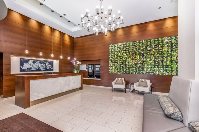 1201 South Prairie Avenue, Unit 3404 Chicago, IL 60605 - Photo 2 of 38 a living room with furniture and a large window