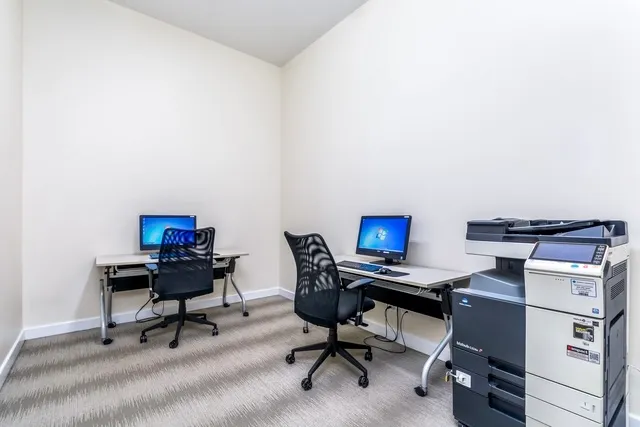 a view of a workspace with furniture