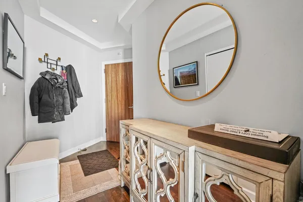 a bathroom with a sink a mirror and a toilet