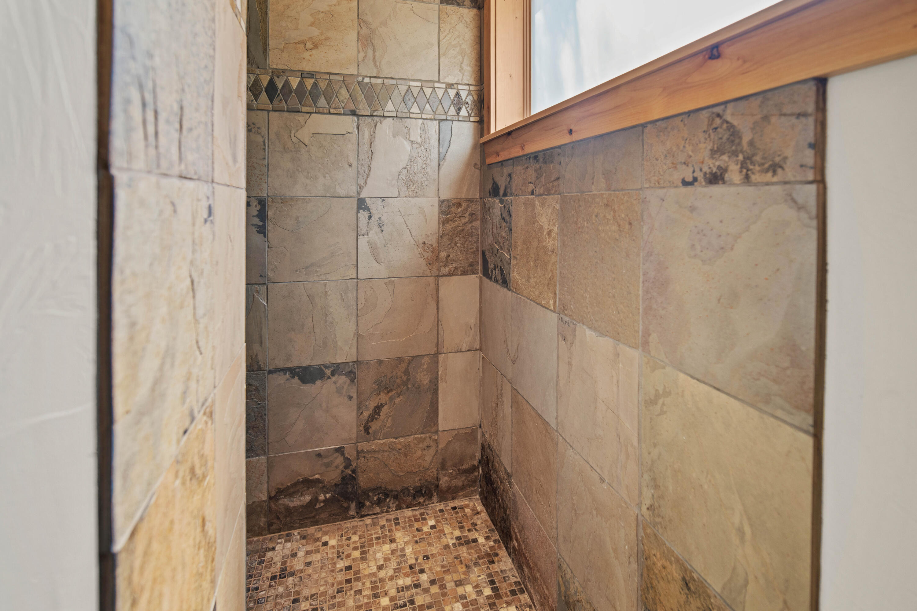 56689 Dancing Rock Loop Bend, OR 97707 - Photo 25 of 51 a bathroom with a shower