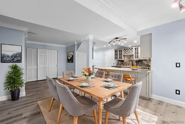 a view of a patio with table and chairs near a tree