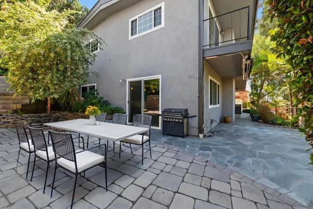 an aerial view of a house with a yard and lake view