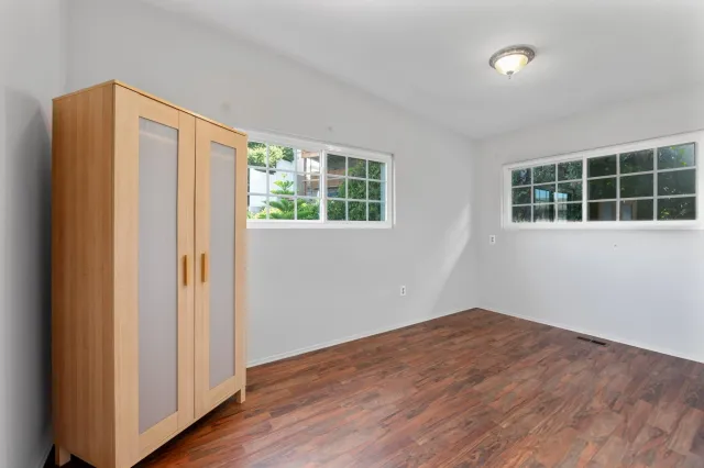 an aerial view of a house with a yard and garden
