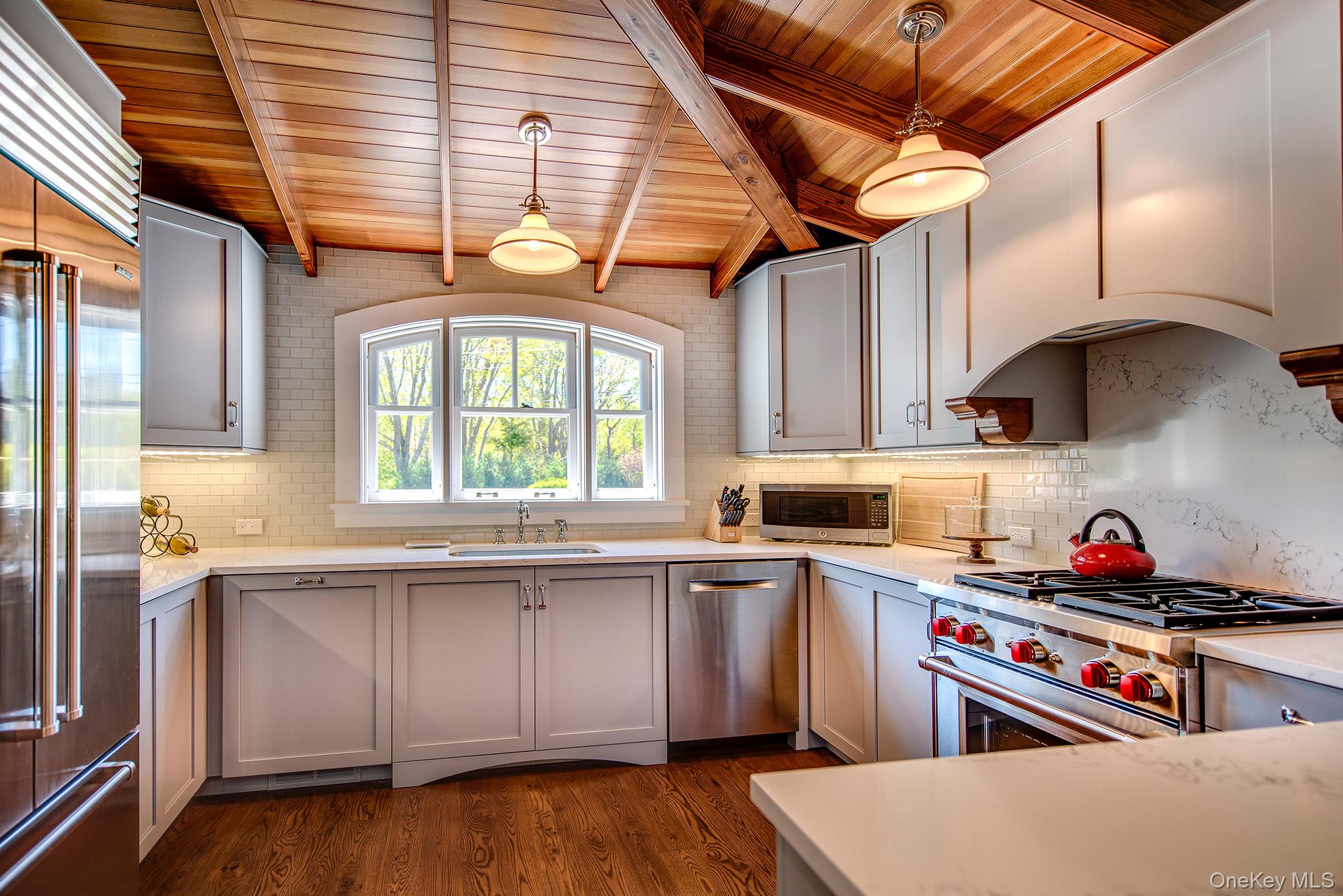 106 Old Depot Road Quogue, NY 11959 - Photo 12 of 34 a kitchen with a sink cabinets and window
