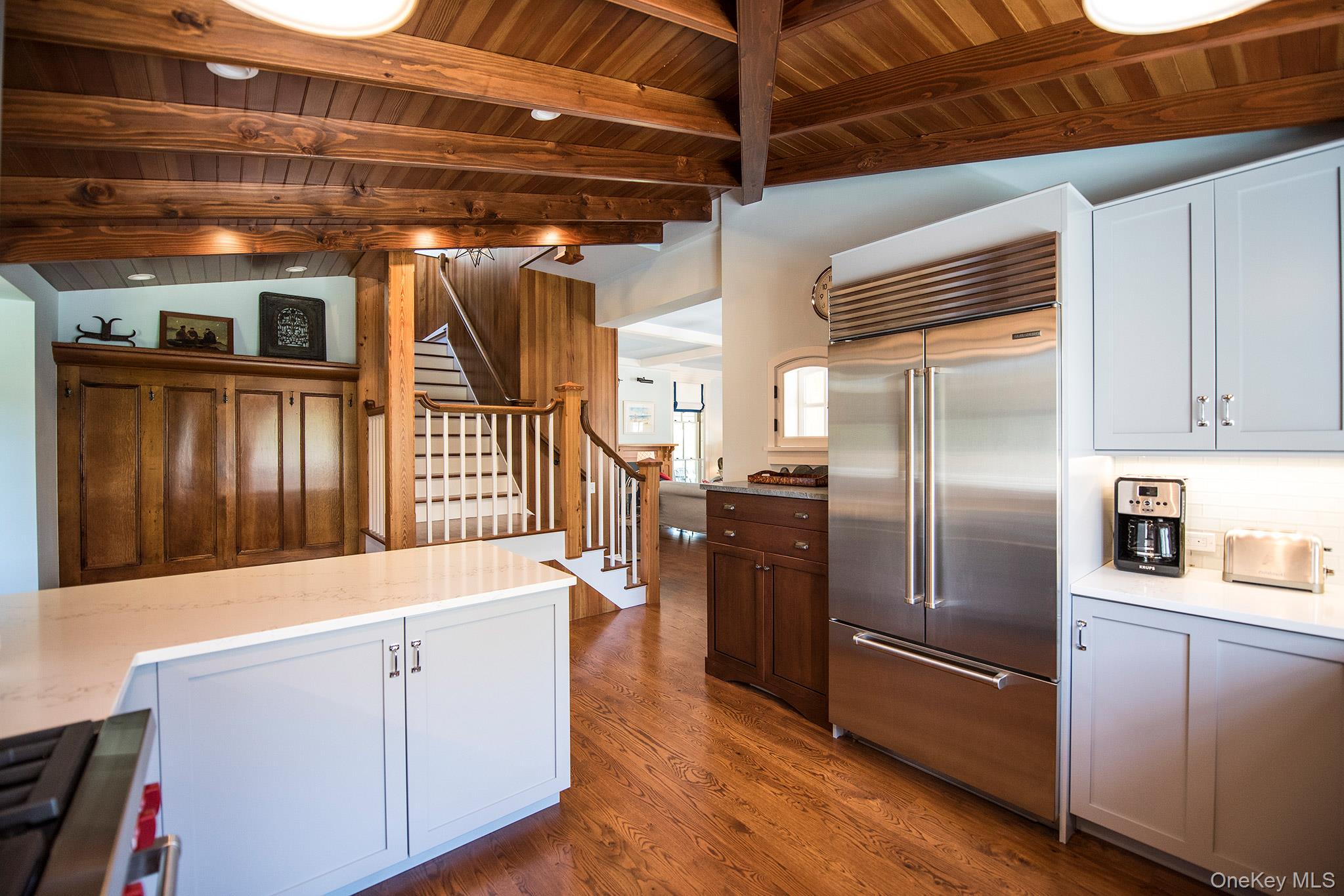 106 Old Depot Road Quogue, NY 11959 - Photo 13 of 34 a kitchen with refrigerator and countertop