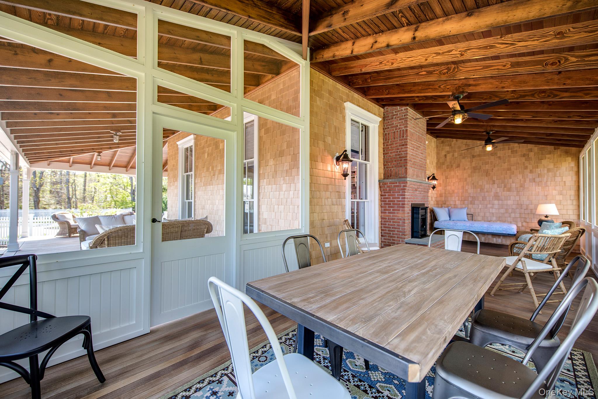 106 Old Depot Road Quogue, NY 11959 - Photo 14 of 34 a dining room with a table and chairs