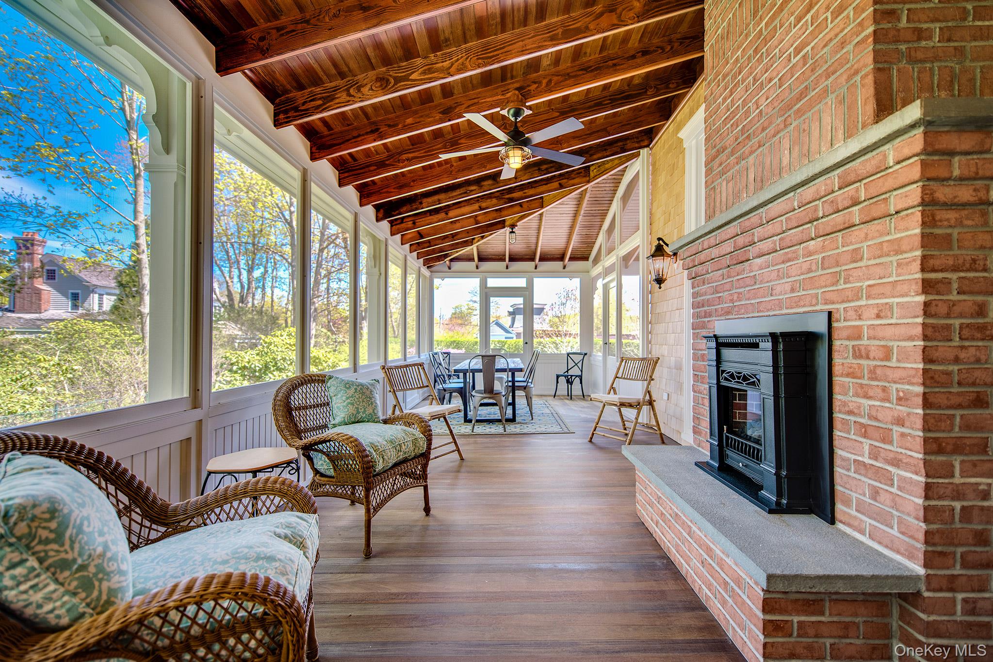 106 Old Depot Road Quogue, NY 11959 - Photo 15 of 34 a living room with furniture and a fireplace