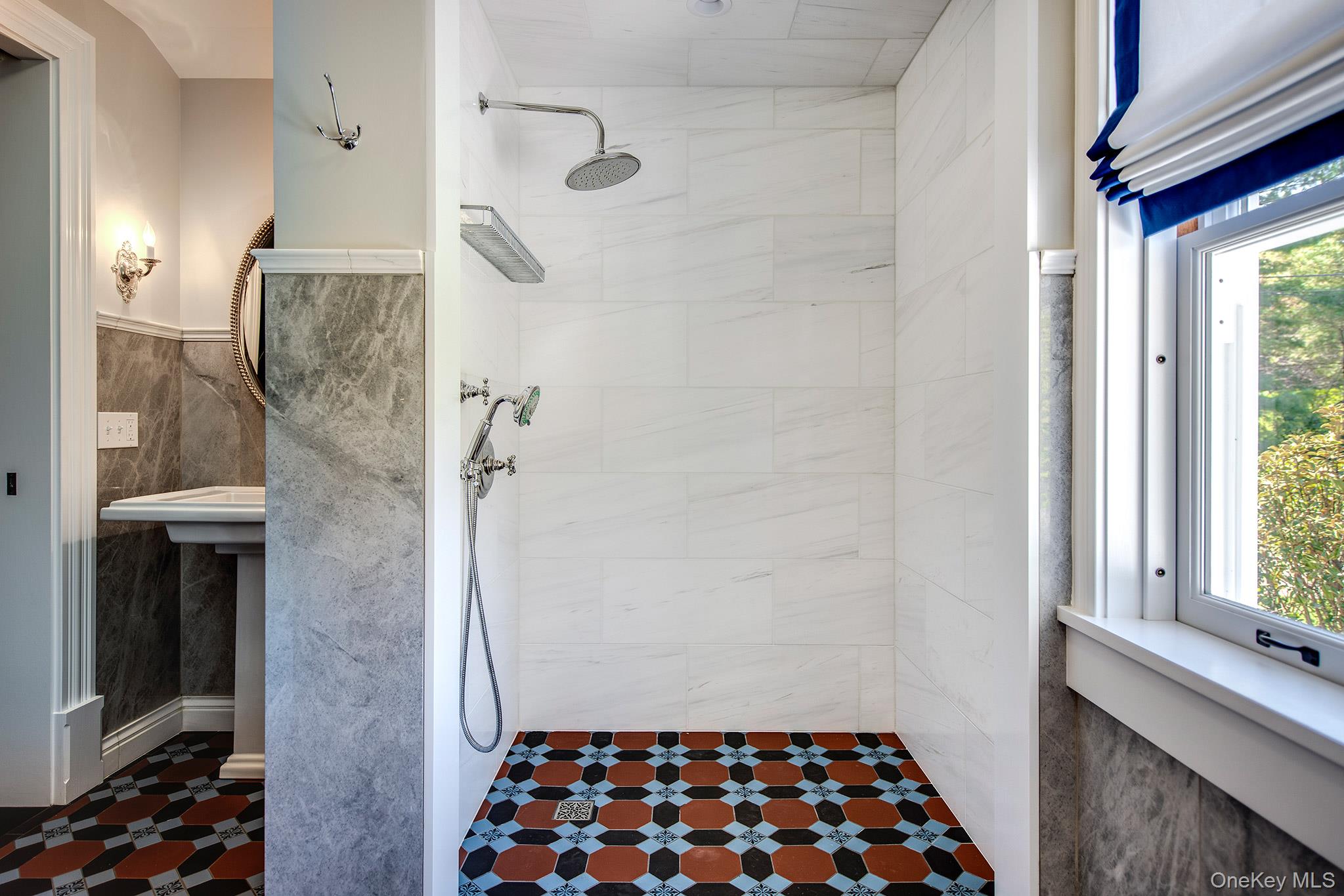 106 Old Depot Road Quogue, NY 11959 - Photo 19 of 34 a bathroom with a sink and a shower