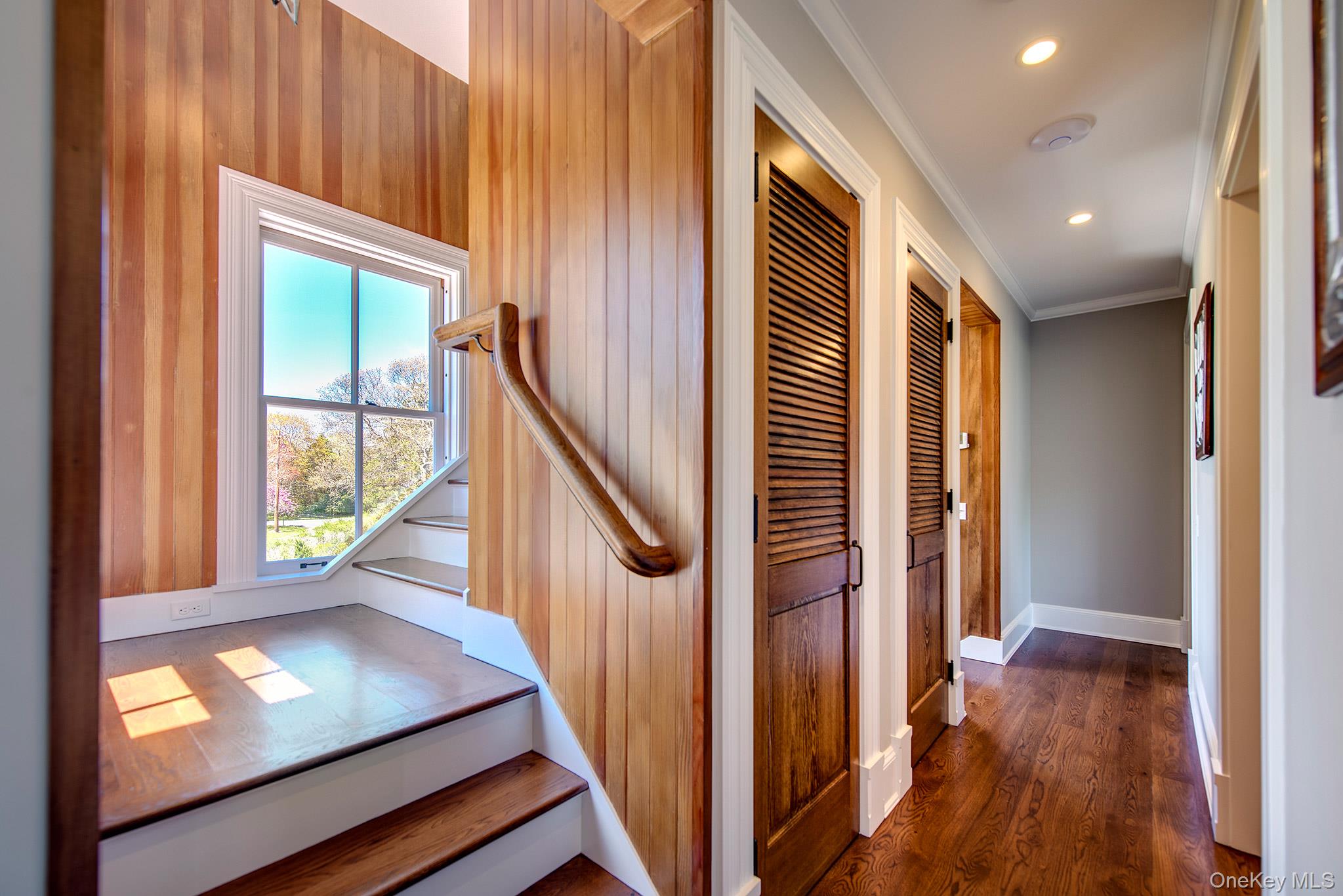 106 Old Depot Road Quogue, NY 11959 - Photo 20 of 34 a view of an entryway with wooden floor and door