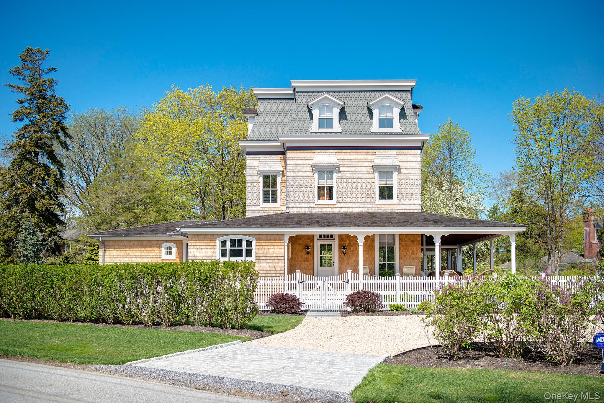 106 Old Depot Road Quogue, NY 11959 - Photo 2 of 34 a front view of a house with a yard