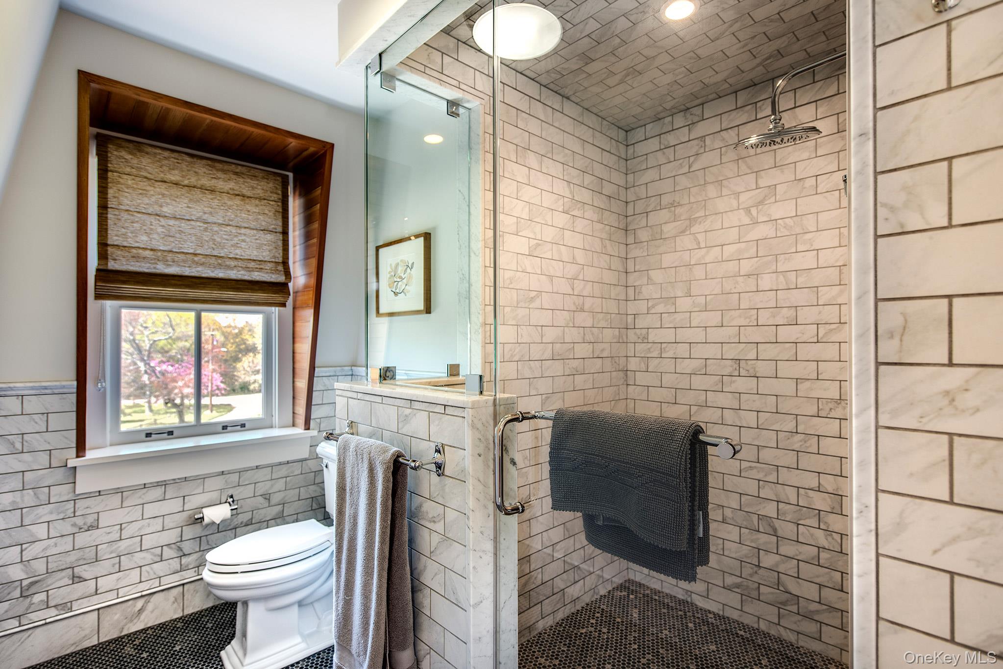 106 Old Depot Road Quogue, NY 11959 - Photo 26 of 34 a bathroom with a toilet sink vanity and mirror
