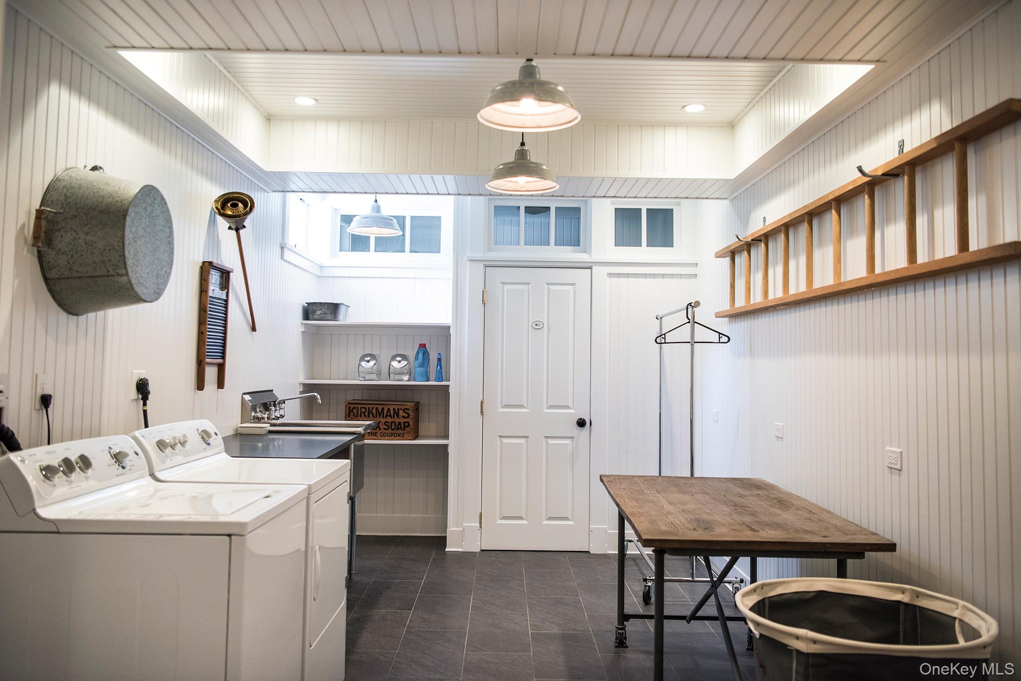 106 Old Depot Road Quogue, NY 11959 - Photo 27 of 34 a kitchen with stainless steel appliances granite countertop a sink stove and refrigerator