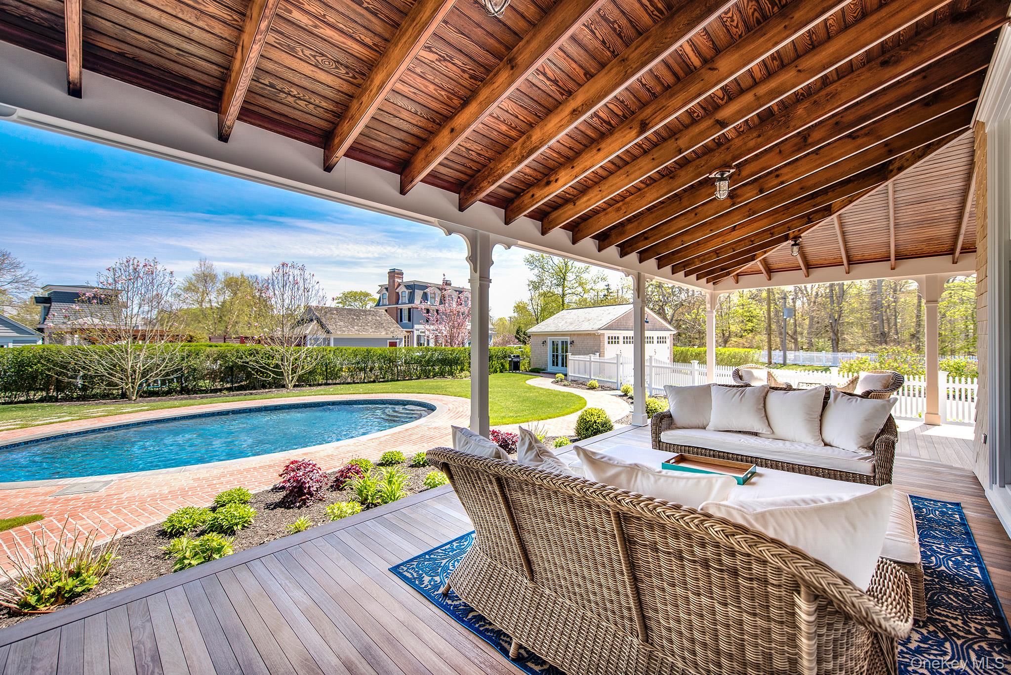 106 Old Depot Road Quogue, NY 11959 - Photo 3 of 34 a view of swimming pool with outdoor seating