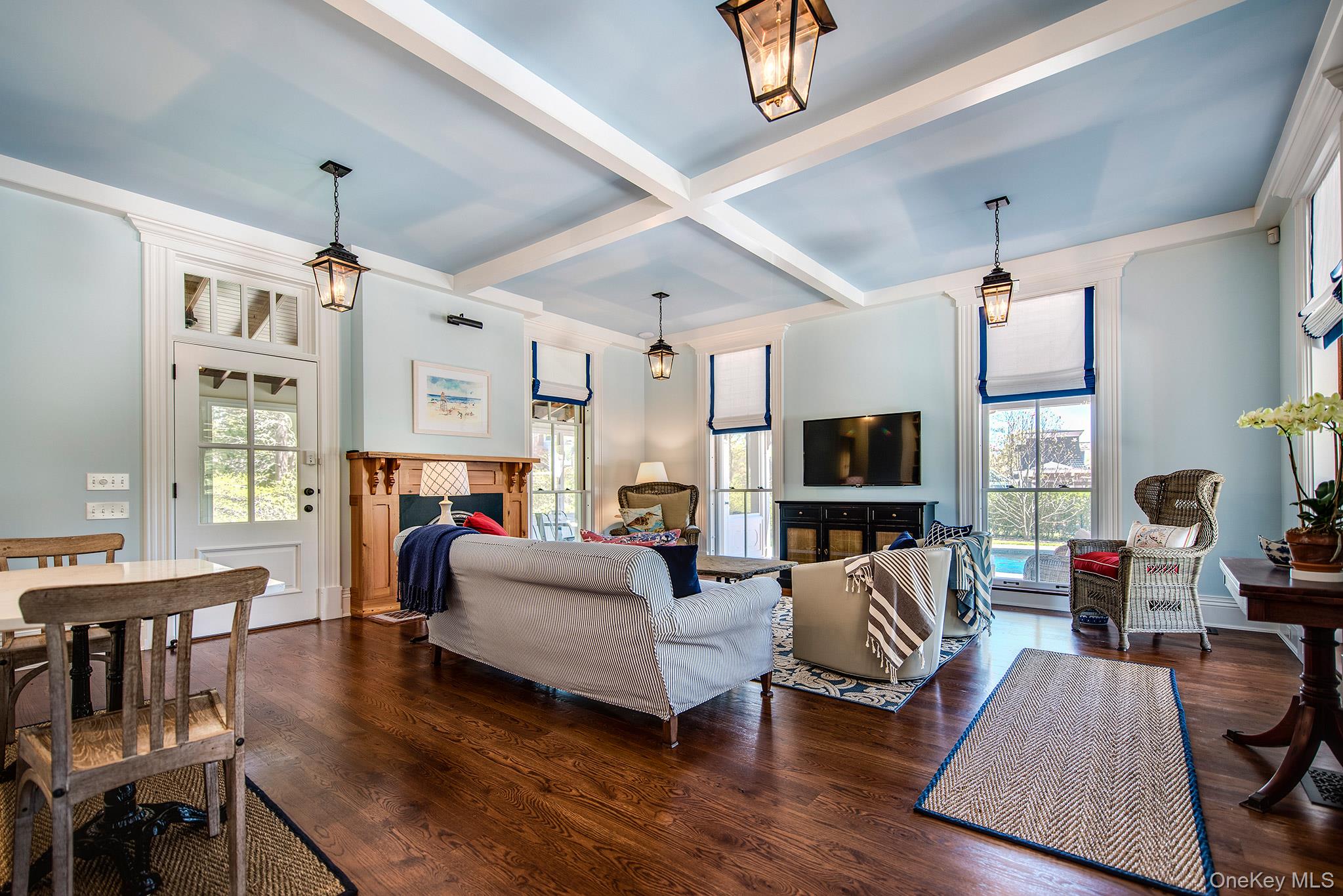 106 Old Depot Road Quogue, NY 11959 - Photo 6 of 34 a living room with furniture a fireplace and a flat screen tv