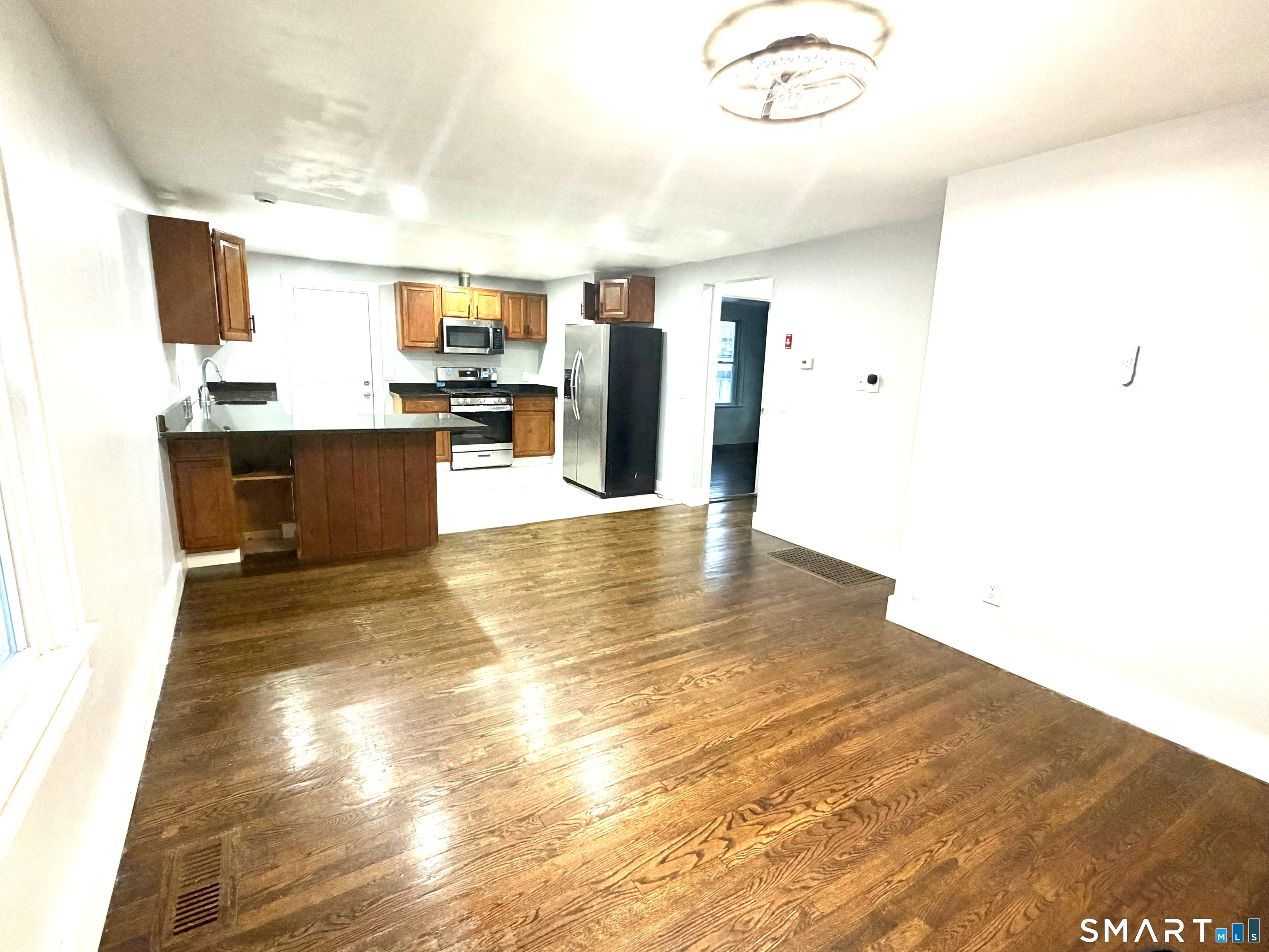 184 Park Street Bridgeport, CT 06608 - Photo 10 of 11 a view of kitchen with furniture and refrigerator