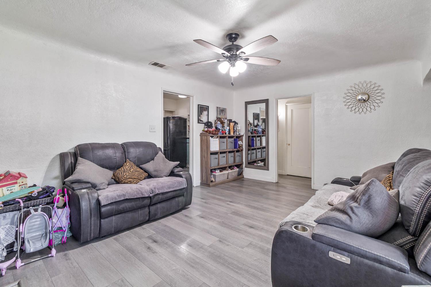 792 Grove Avenue Gustine, CA 95322 - Photo 13 of 32 a living room with furniture and wooden floor