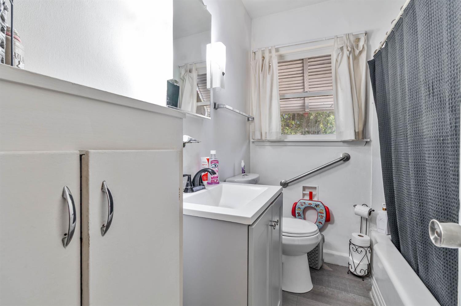 792 Grove Avenue Gustine, CA 95322 - Photo 17 of 32 a bathroom with a sink toilet and shower
