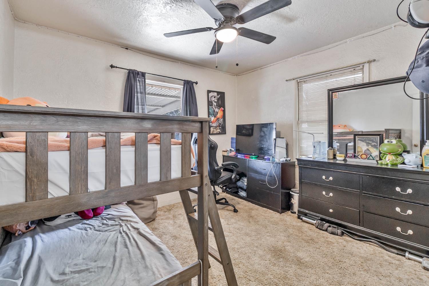 792 Grove Avenue Gustine, CA 95322 - Photo 19 of 32 a bedroom with furniture and a window