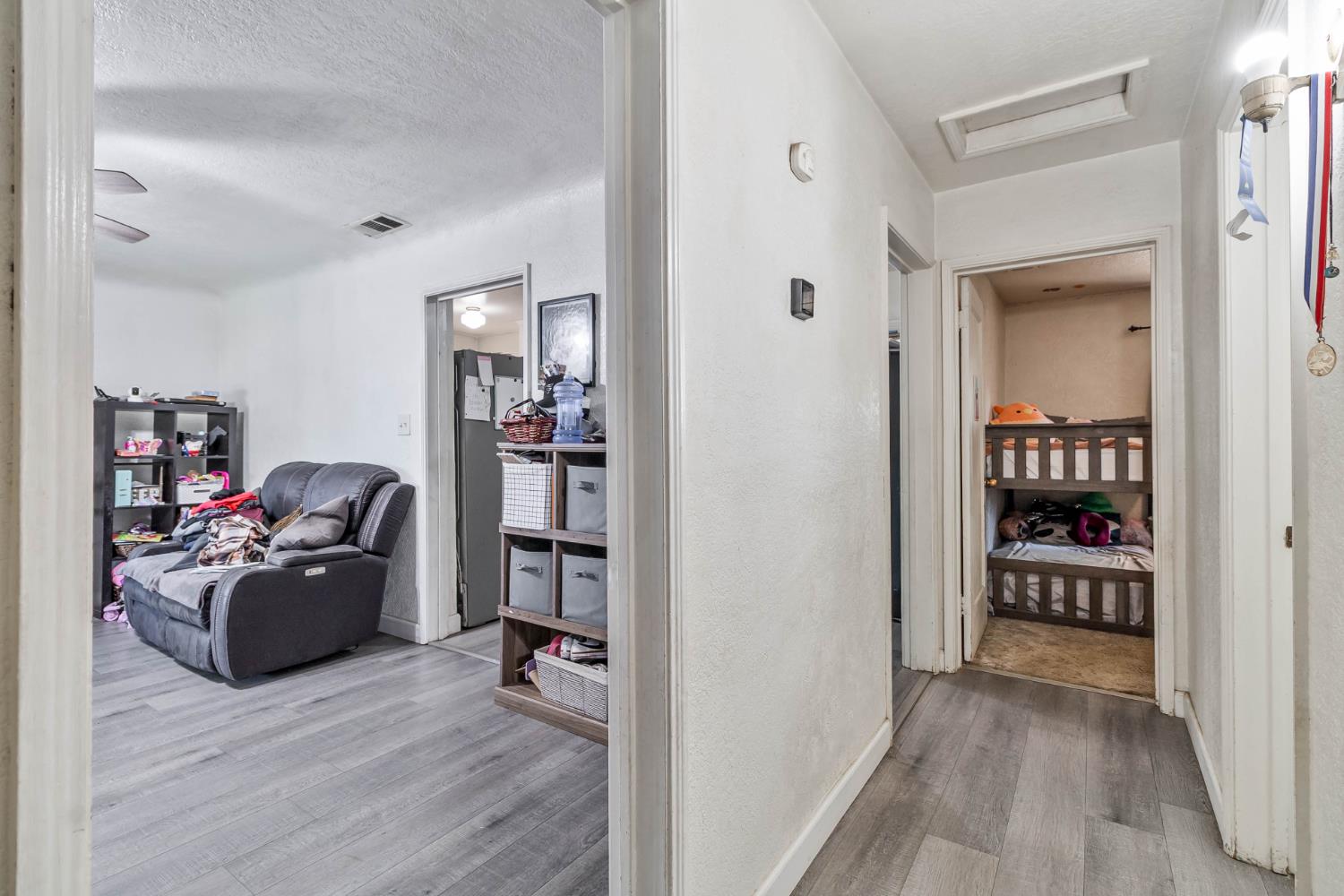 792 Grove Avenue Gustine, CA 95322 - Photo 22 of 32 a view of a workspace with wooden floor and furniture