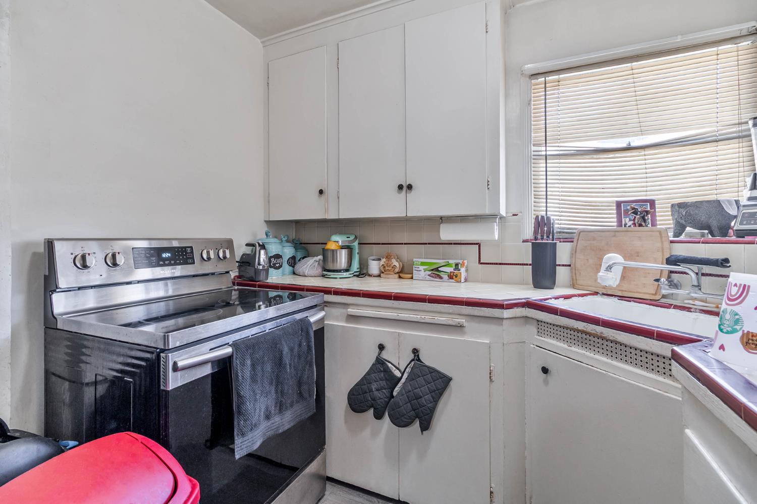 792 Grove Avenue Gustine, CA 95322 - Photo 9 of 32 a kitchen with a sink stove and cabinets