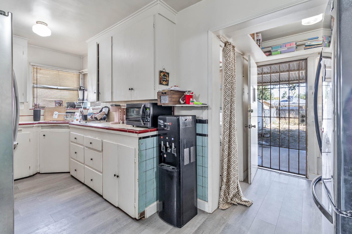 792 Grove Avenue Gustine, CA 95322 - Photo 10 of 32 a kitchen with a refrigerator and a sink