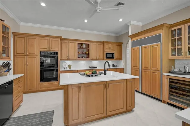 a view of a dining room and a livingroom with furniture wooden floor a chandelier