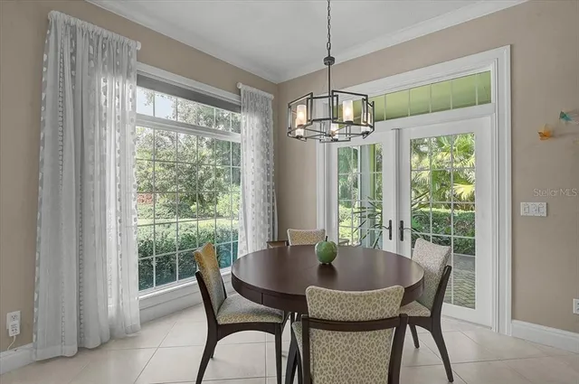 a living room with furniture and a work place