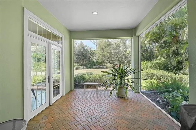 a dining room with furniture a rug and a chandelier