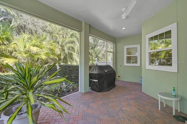 a view of a living room with furniture and garden view
