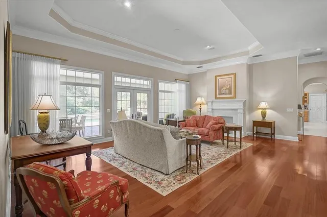 a living room with furniture a window and a table