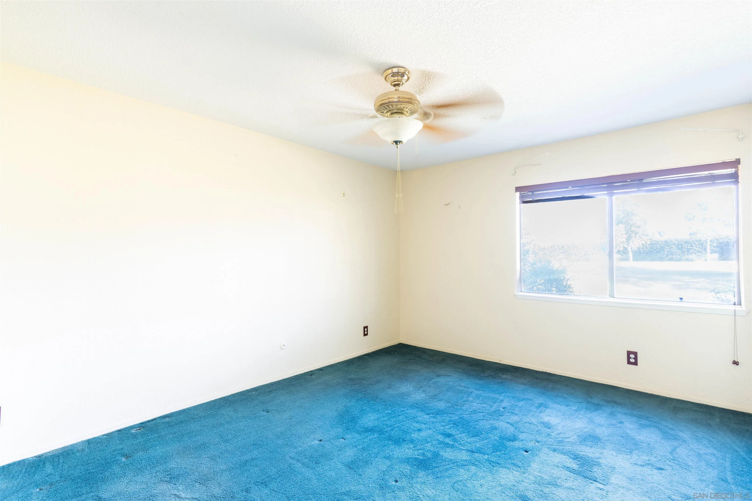 2825 Irving Street Riverside, CA 92504 - Photo 11 of 31 an empty room with a window
