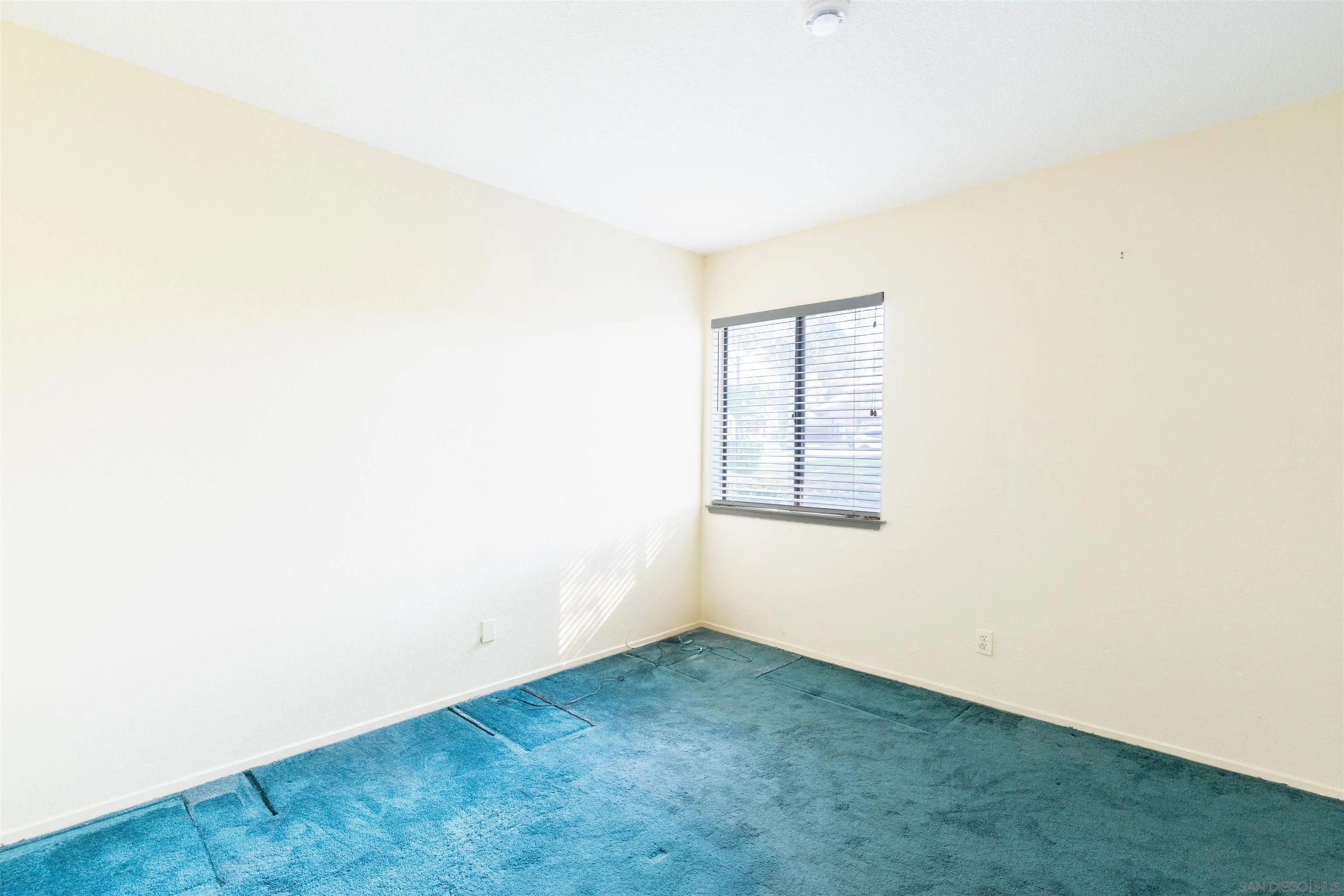 2825 Irving Street Riverside, CA 92504 - Photo 14 of 31 a view of an empty room with a window