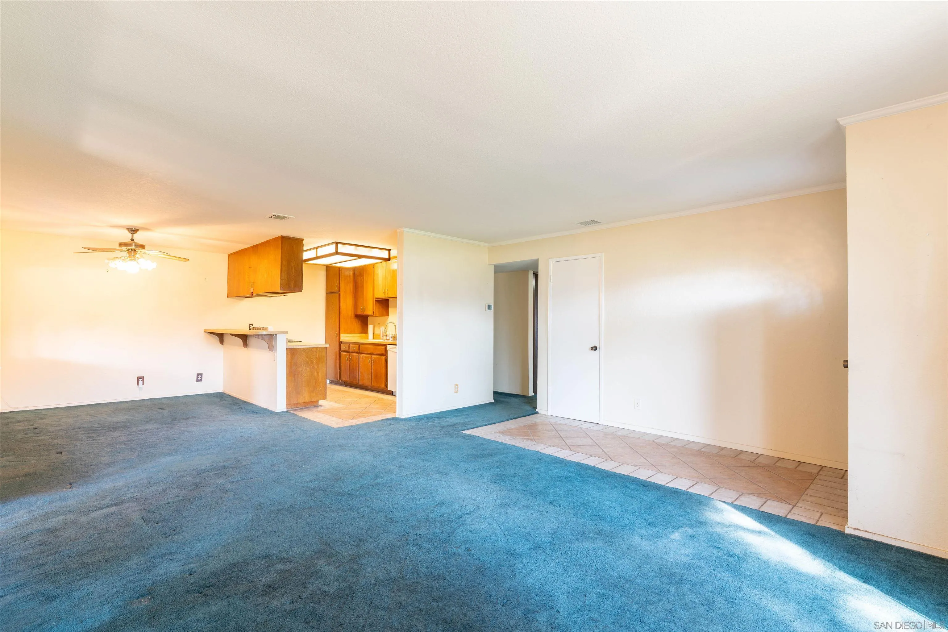 2825 Irving Street Riverside, CA 92504 - Photo 6 of 31 a view of an empty room with wooden floor and a window