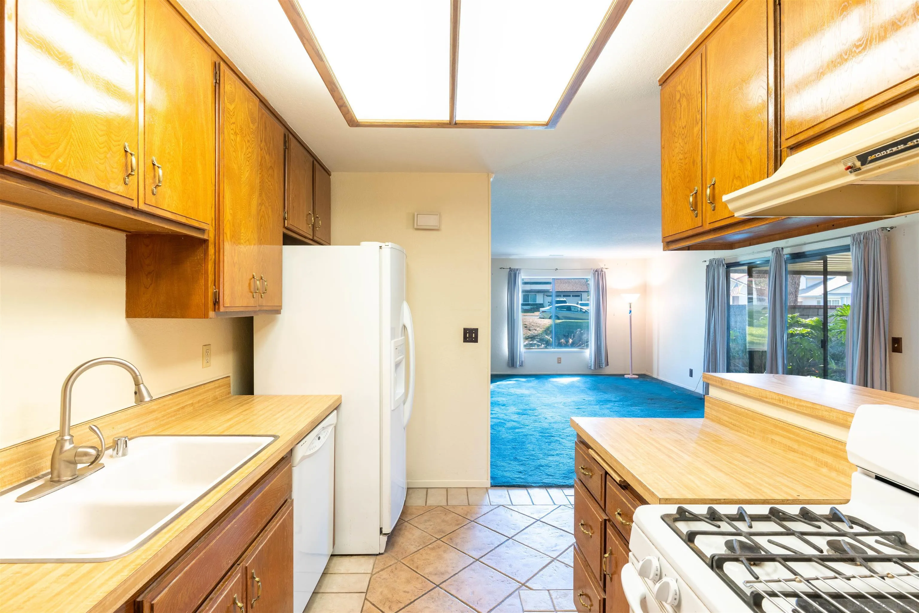 2825 Irving Street Riverside, CA 92504 - Photo 8 of 31 a kitchen with a sink a stove and refrigerator